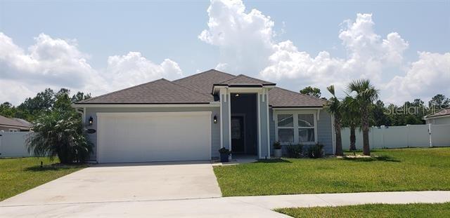 602 Crescent Key Drive St. Augustine, FL 32086 - Photo 1 of 1 a front view of a house with garden