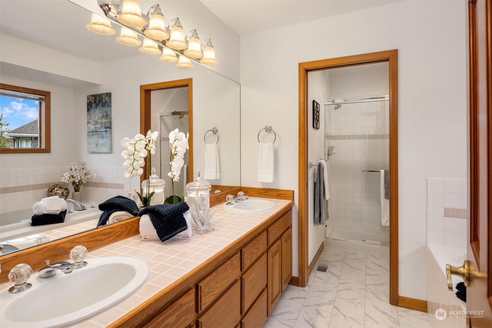 21121 50th Drive Southeast Bothell, WA 98021 - Photo 13 of 38 a bathroom with a granite countertop sink a large mirror and a shower
