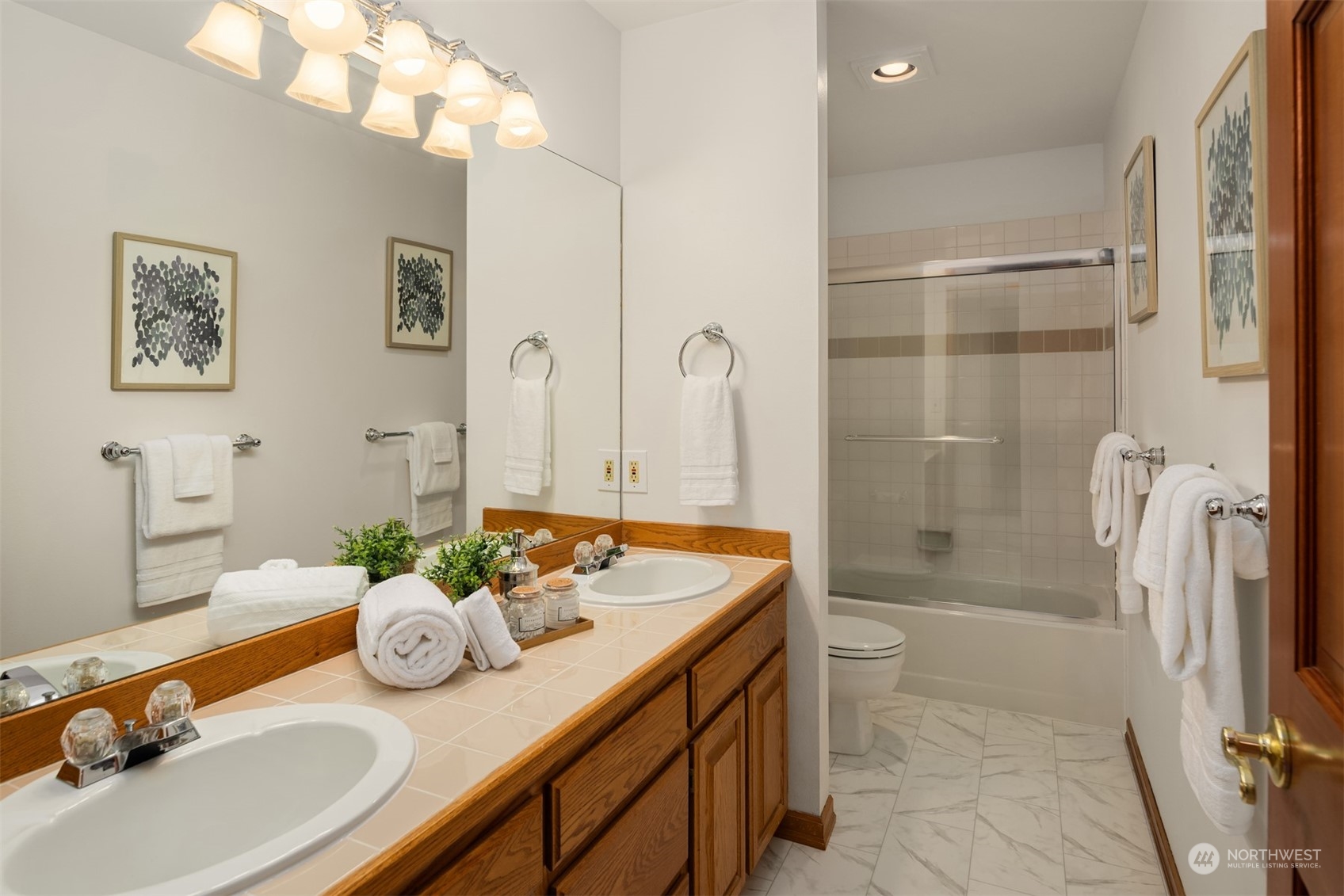 21121 50th Drive Southeast Bothell, WA 98021 - Photo 17 of 38 a bathroom with a granite countertop sink a mirror and a shower