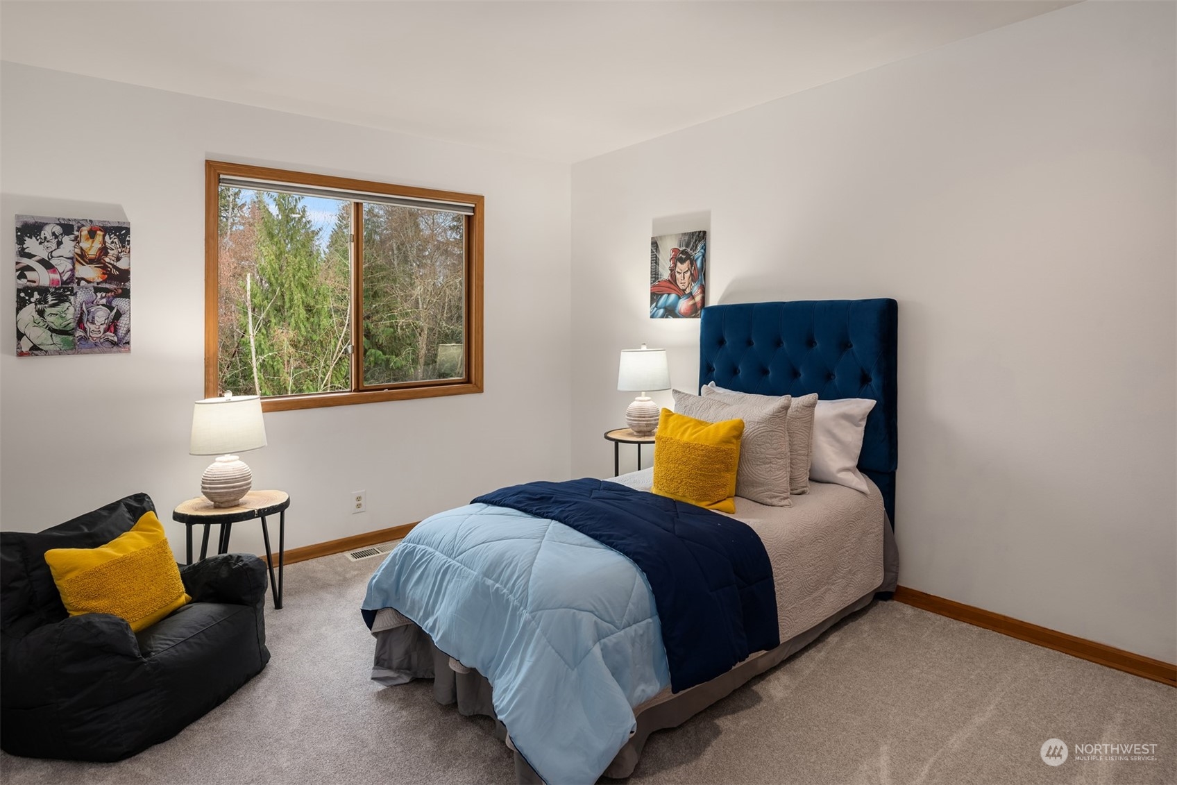 21121 50th Drive Southeast Bothell, WA 98021 - Photo 18 of 38 a bedroom with a bed and blue lamp on dresser next to a window
