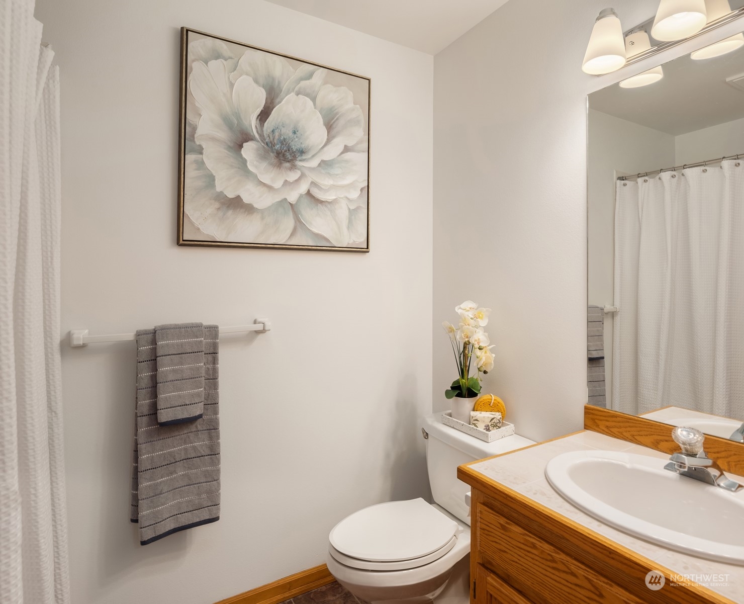 21121 50th Drive Southeast Bothell, WA 98021 - Photo 19 of 38 a bathroom with a sink vanity mirror and toilet