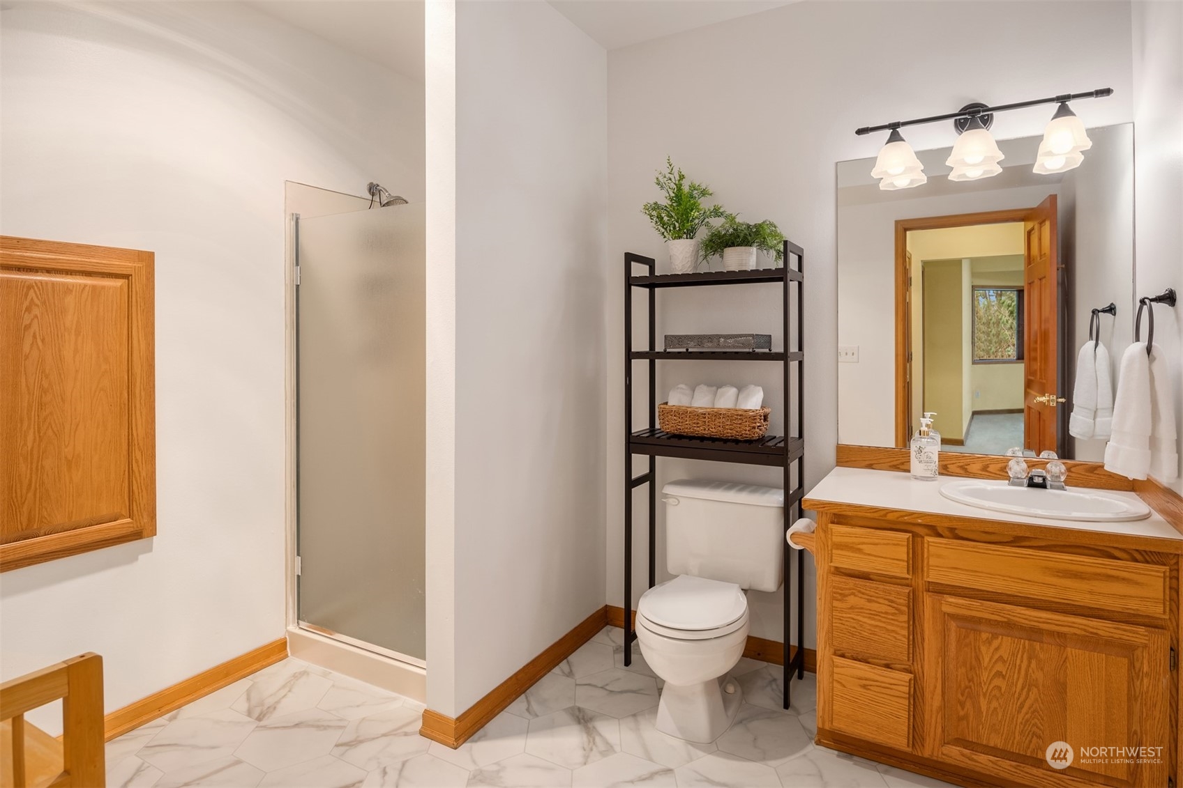 21121 50th Drive Southeast Bothell, WA 98021 - Photo 22 of 38 a bathroom with a toilet sink and mirror
