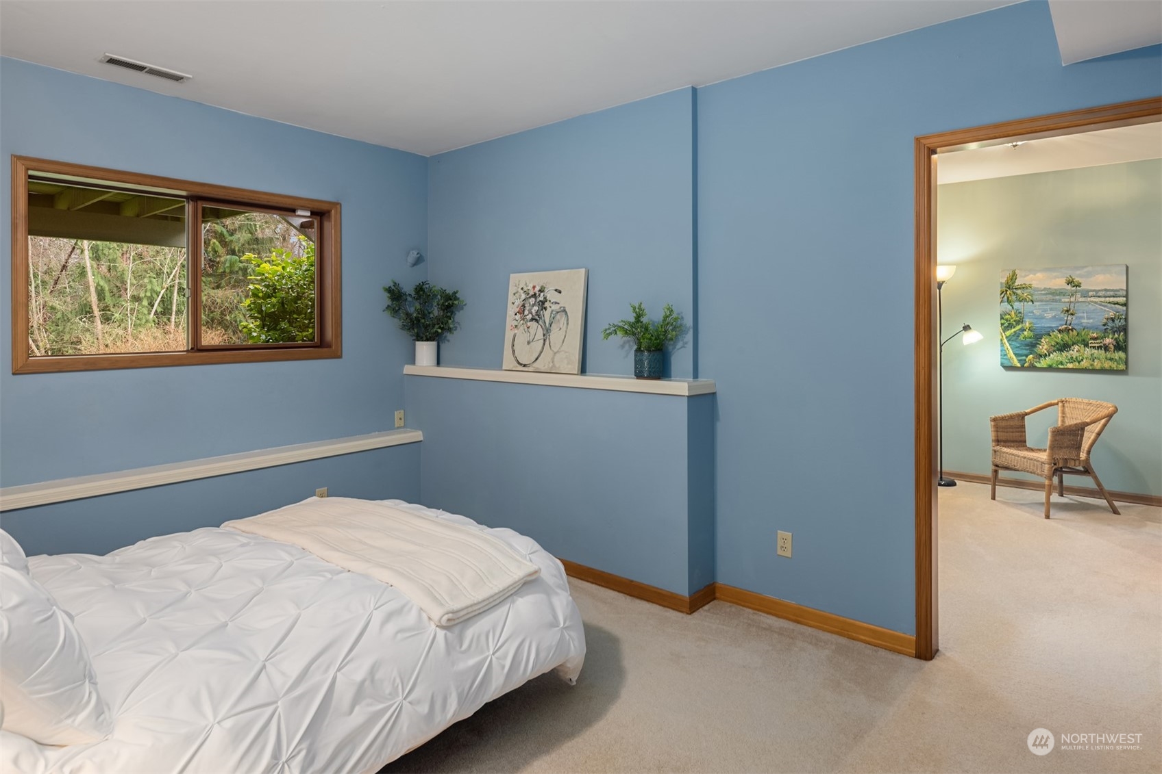 21121 50th Drive Southeast Bothell, WA 98021 - Photo 24 of 38 a bedroom with a bed and a painting on the wall