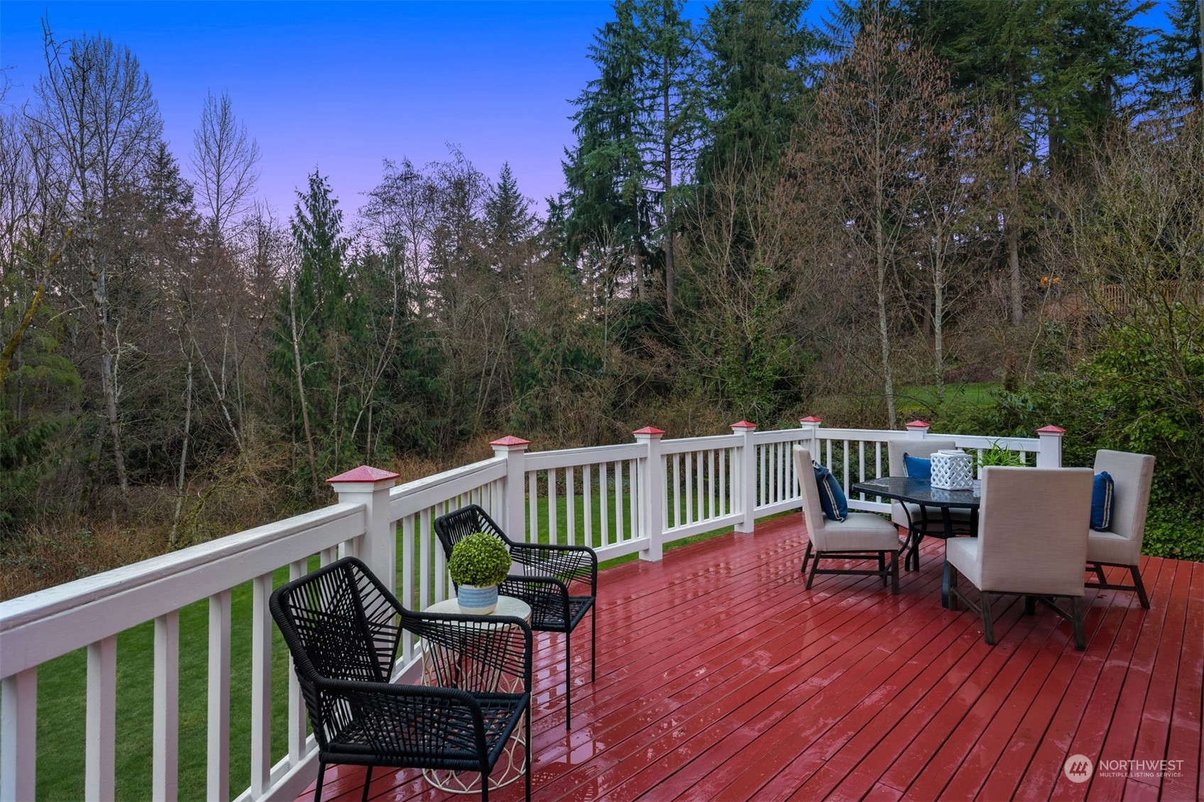 21121 50th Drive Southeast Bothell, WA 98021 - Photo 27 of 38 a view of a chair and table on the wooden deck