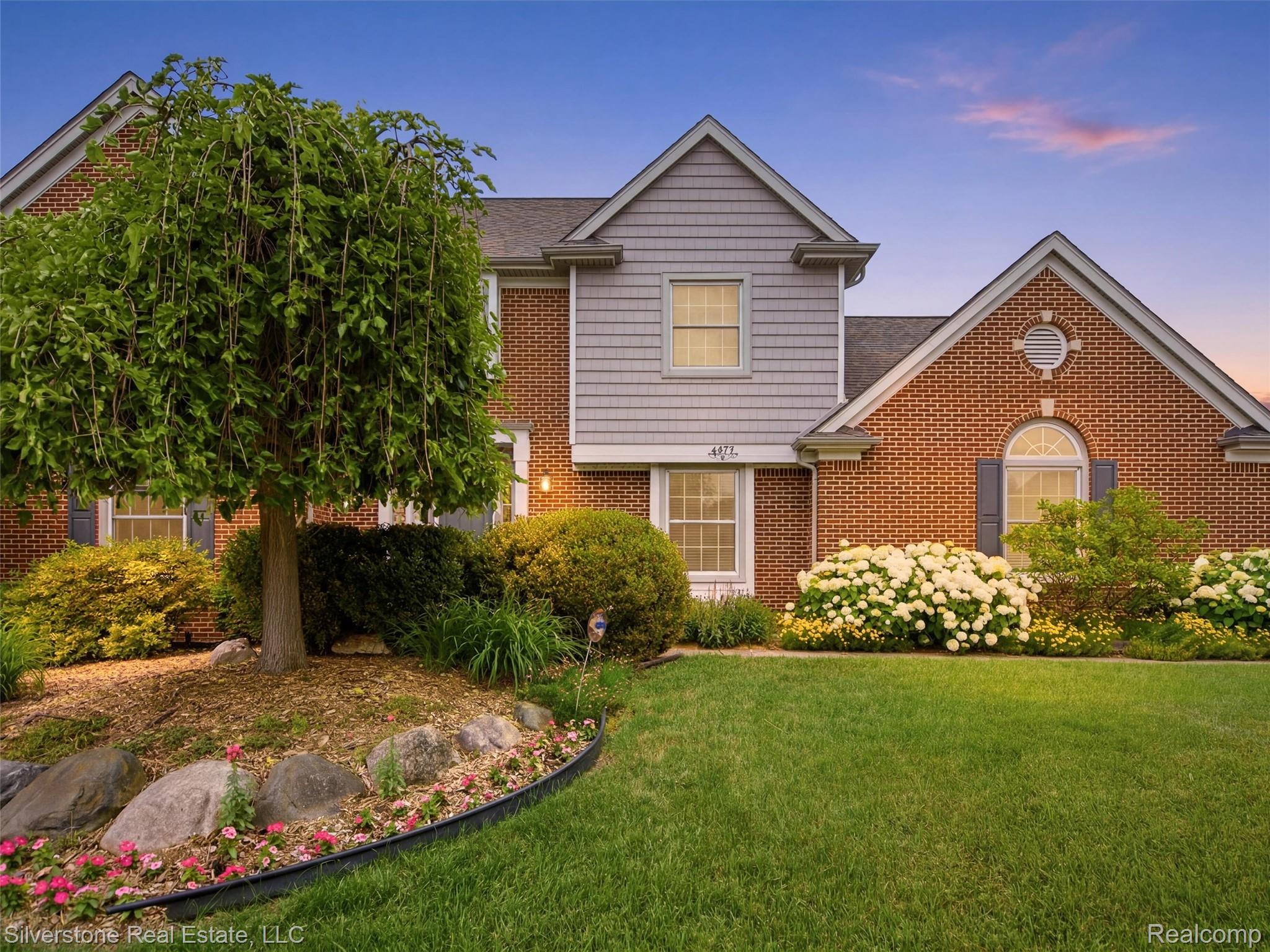 6577 Edith Court Troy, MI 48085 - Photo 1 of 61 Brick exterior featuring gabled roofs and gray siding accents