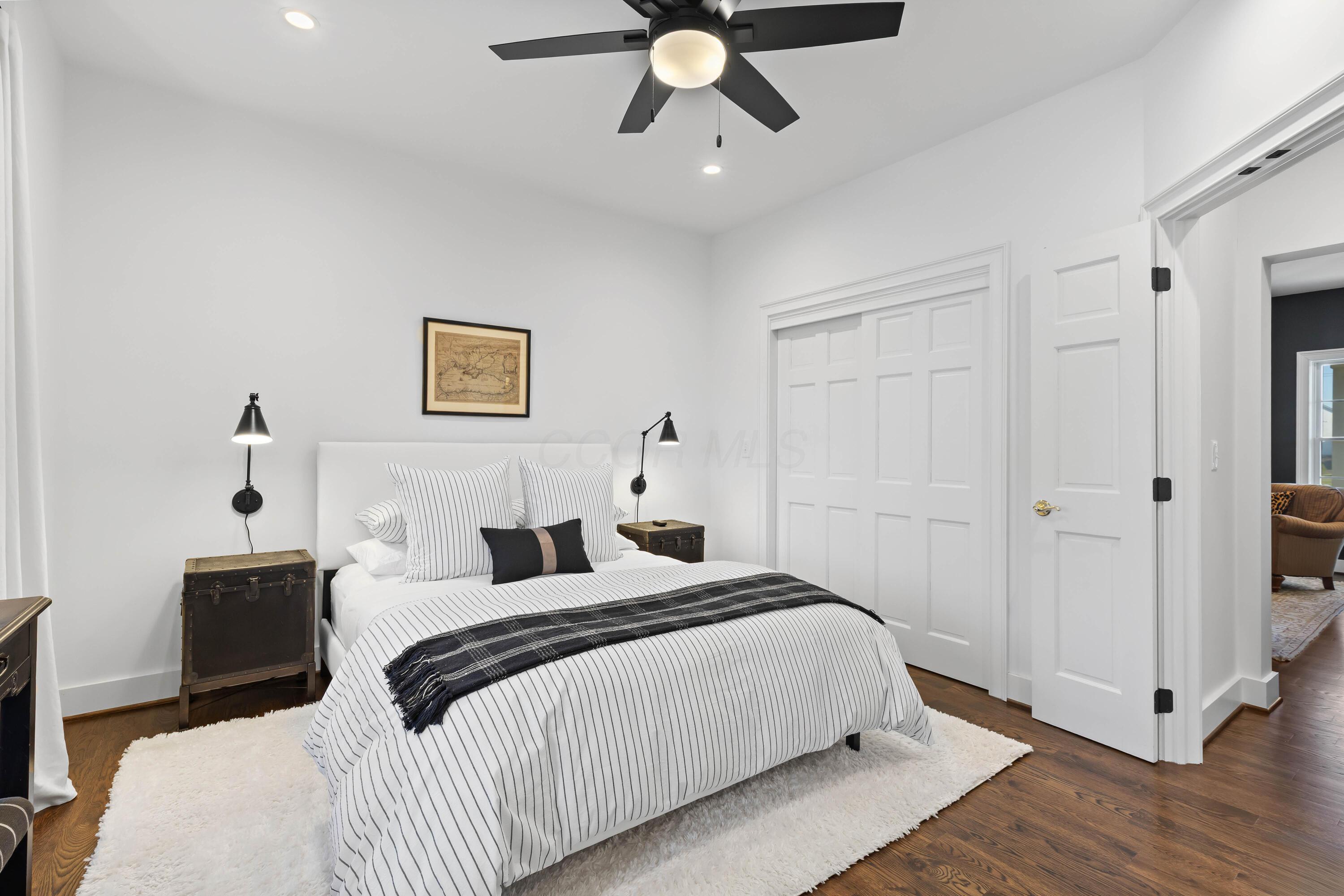 1364 Dale Ford Road Delaware, OH 43015 - Photo 24 of 112 • Hardwood flooring • White painted walls • Can lighting • Lighted ceiling fan • Bay wall • Closet with double sliding doors • Closet organizer • Wall lights are negotiable • French door to hall