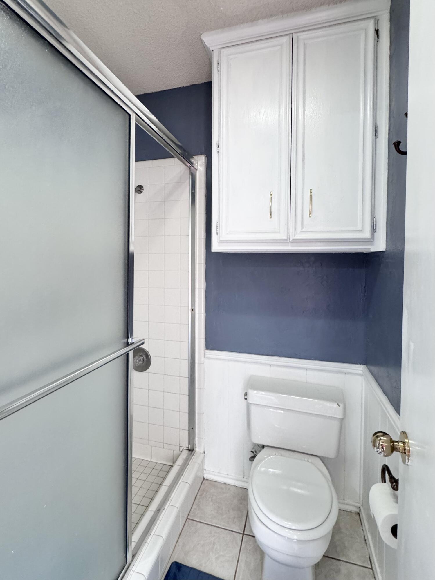 5617 87th Street Lubbock, TX 79424 - Photo 11 of 22 a bathroom with a toilet and a shower