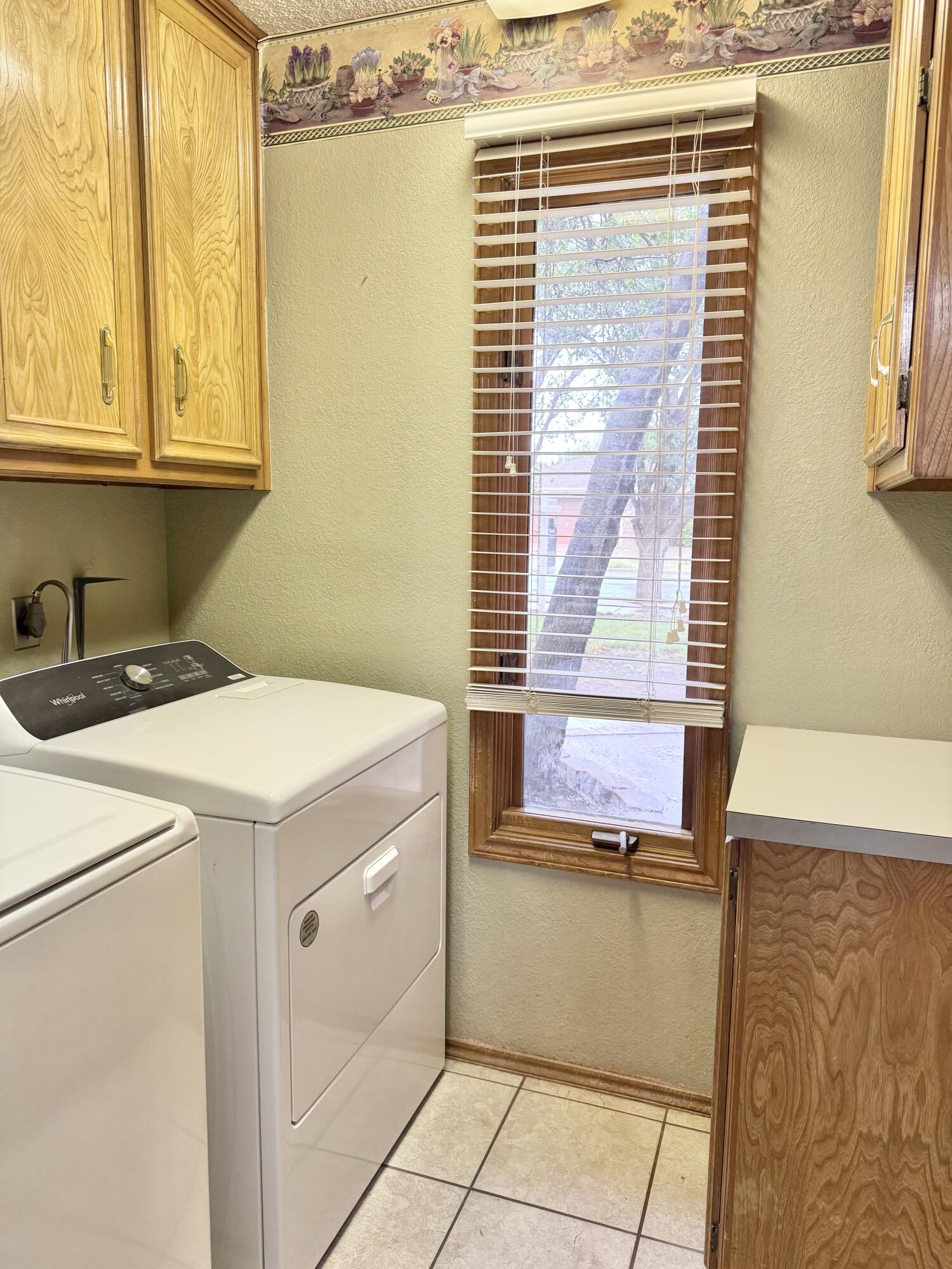 5617 87th Street Lubbock, TX 79424 - Photo 19 of 22 a utility room with a window