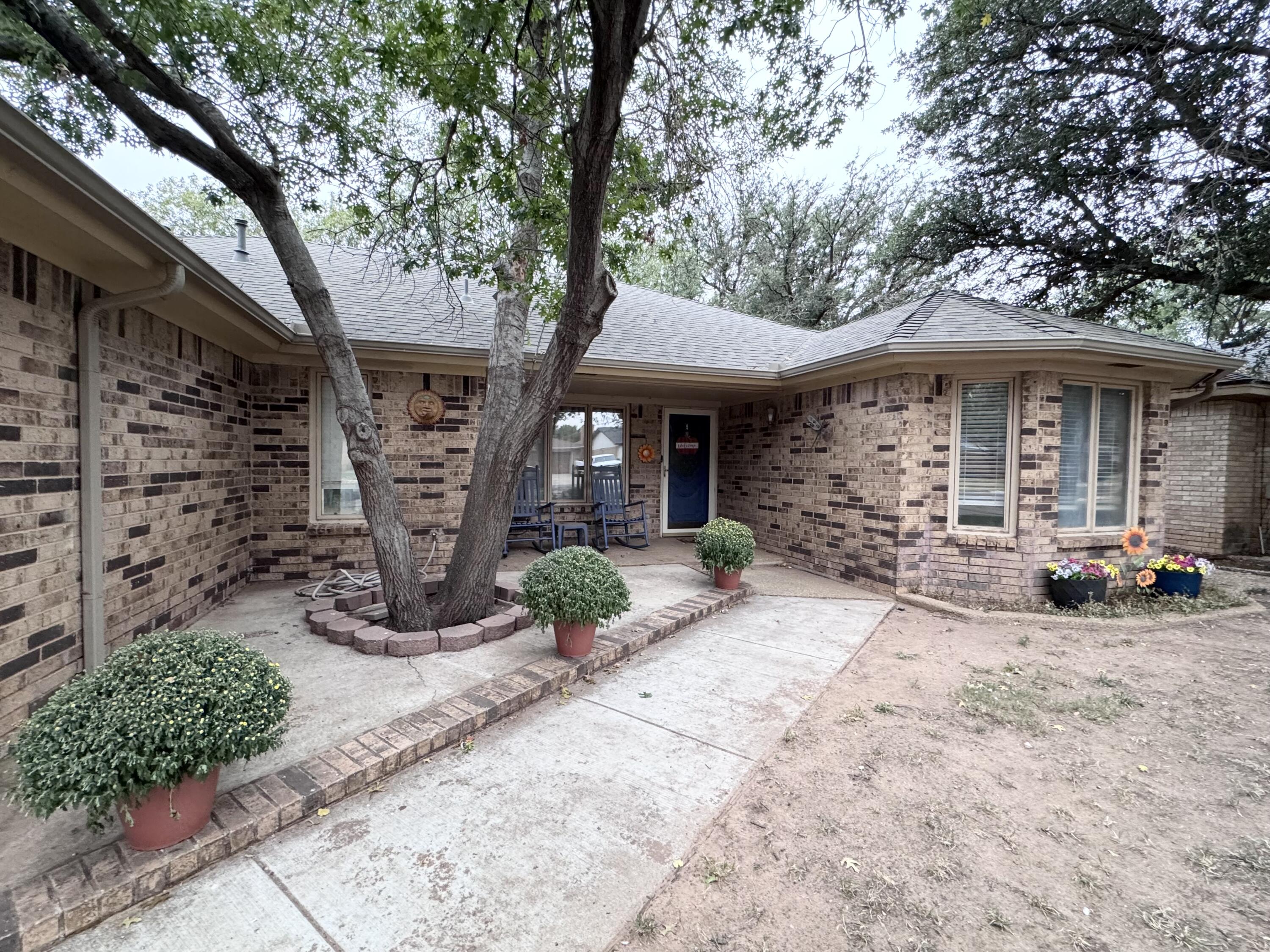 5617 87th Street Lubbock, TX 79424 - Photo 2 of 22 a view of a car park in front of house