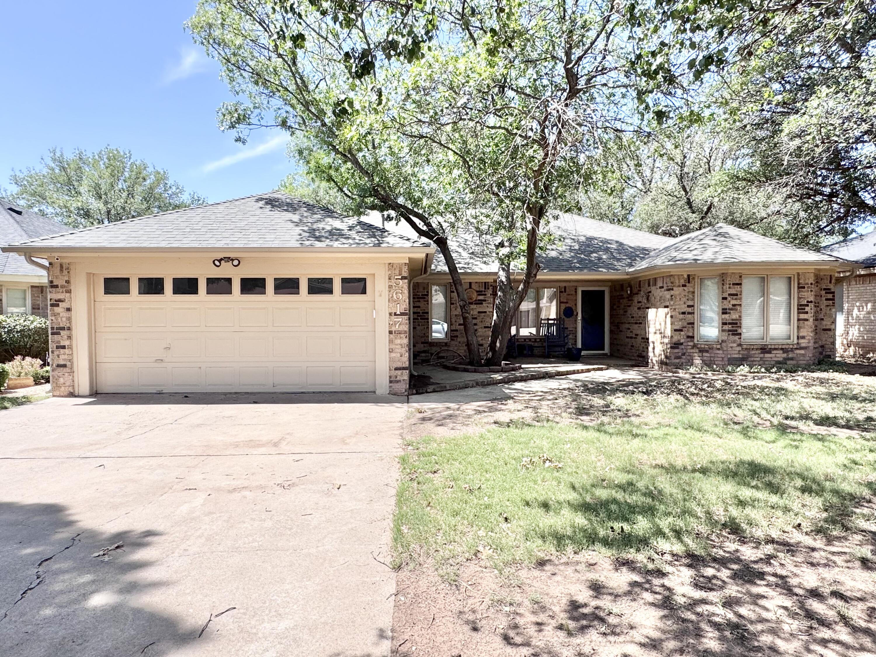 5617 87th Street Lubbock, TX 79424 - Photo 5 of 22 a front view of a house with a yard