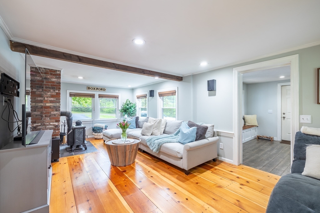 26 Roundtop Road Boxford, MA 01921 - Photo 11 of 42 a living room with furniture and a large window
