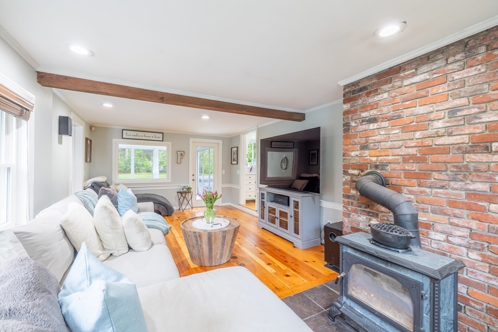 26 Roundtop Road Boxford, MA 01921 - Photo 12 of 42 a living room with furniture and a flat screen tv