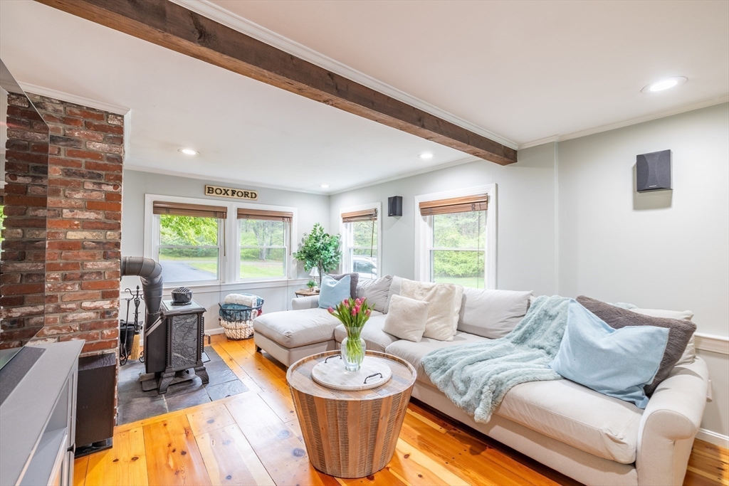26 Roundtop Road Boxford, MA 01921 - Photo 13 of 42 a living room with furniture and a large window