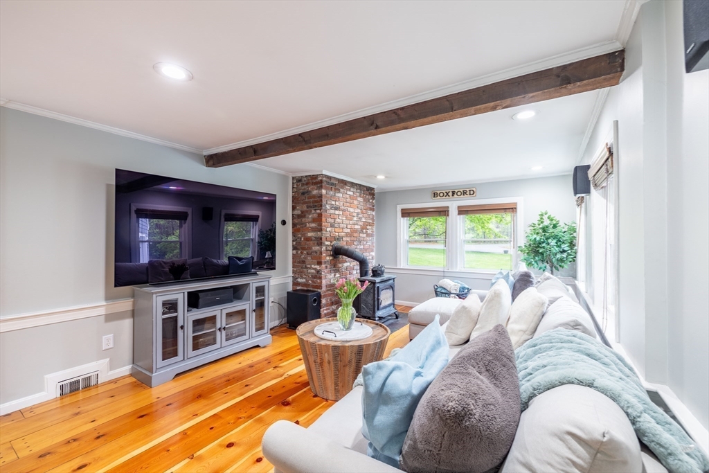26 Roundtop Road Boxford, MA 01921 - Photo 14 of 42 a living room with furniture and a flat screen tv