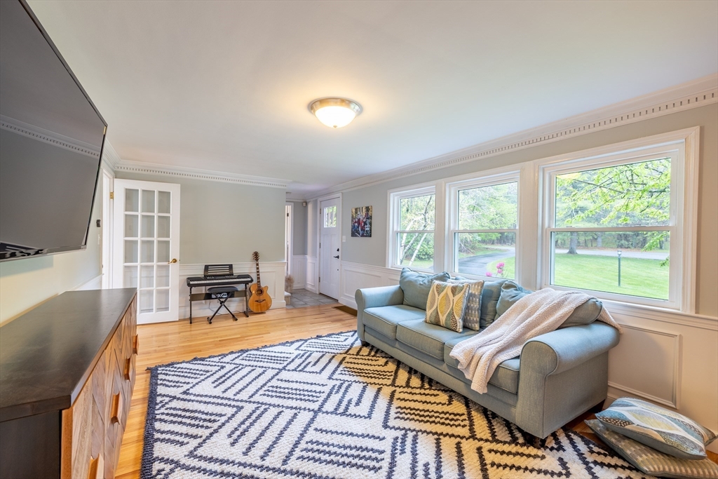 26 Roundtop Road Boxford, MA 01921 - Photo 15 of 42 a living room with furniture and a flat screen tv