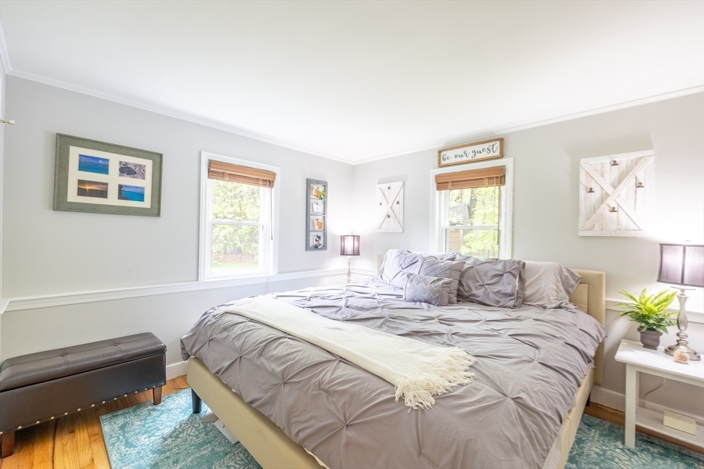 26 Roundtop Road Boxford, MA 01921 - Photo 19 of 42 a bedroom with a bed and a couch
