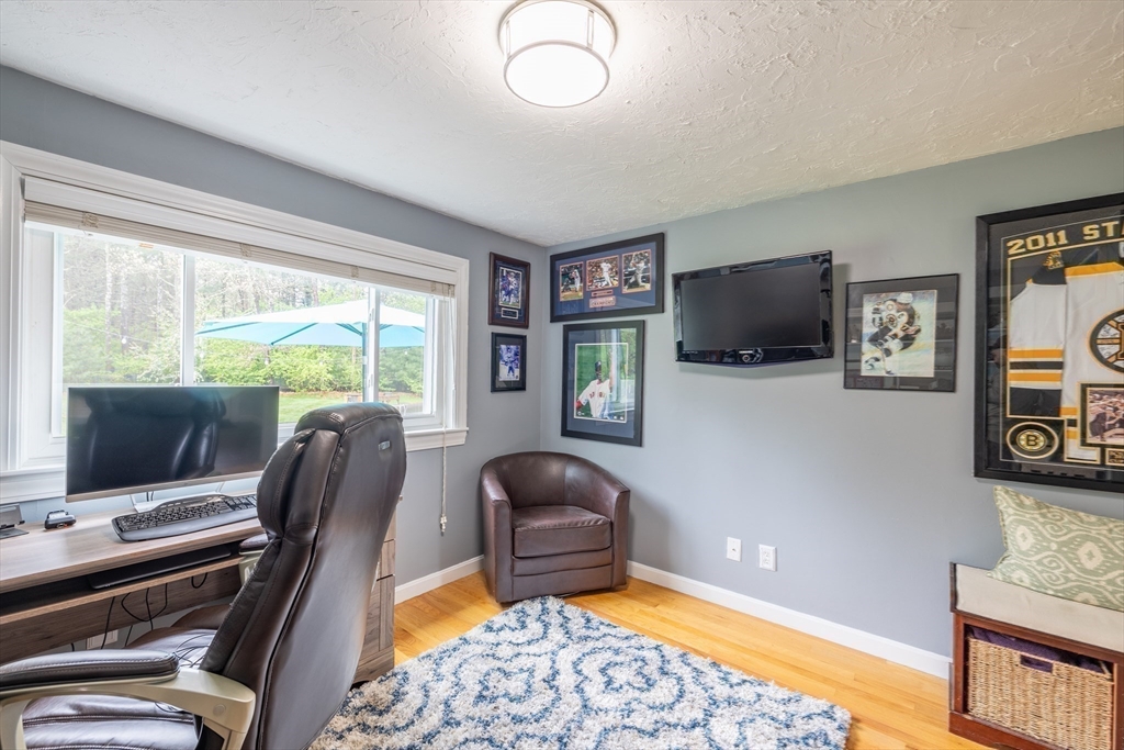 26 Roundtop Road Boxford, MA 01921 - Photo 22 of 42 a living room with furniture and a flat screen tv