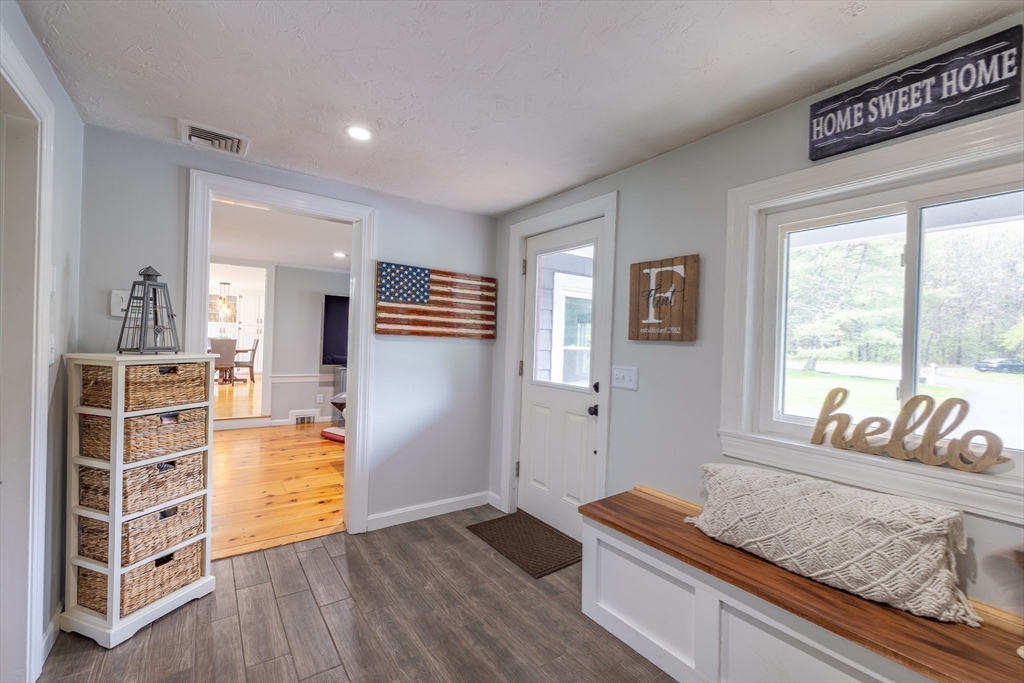 26 Roundtop Road Boxford, MA 01921 - Photo 25 of 42 a living room with furniture and a dresser