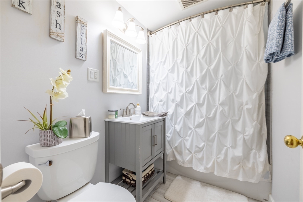 26 Roundtop Road Boxford, MA 01921 - Photo 26 of 42 a white toilet sitting next to a bathroom sink