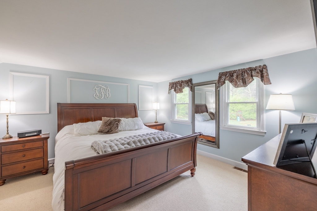 26 Roundtop Road Boxford, MA 01921 - Photo 27 of 42 a bedroom with a bed and a dresser next to a window