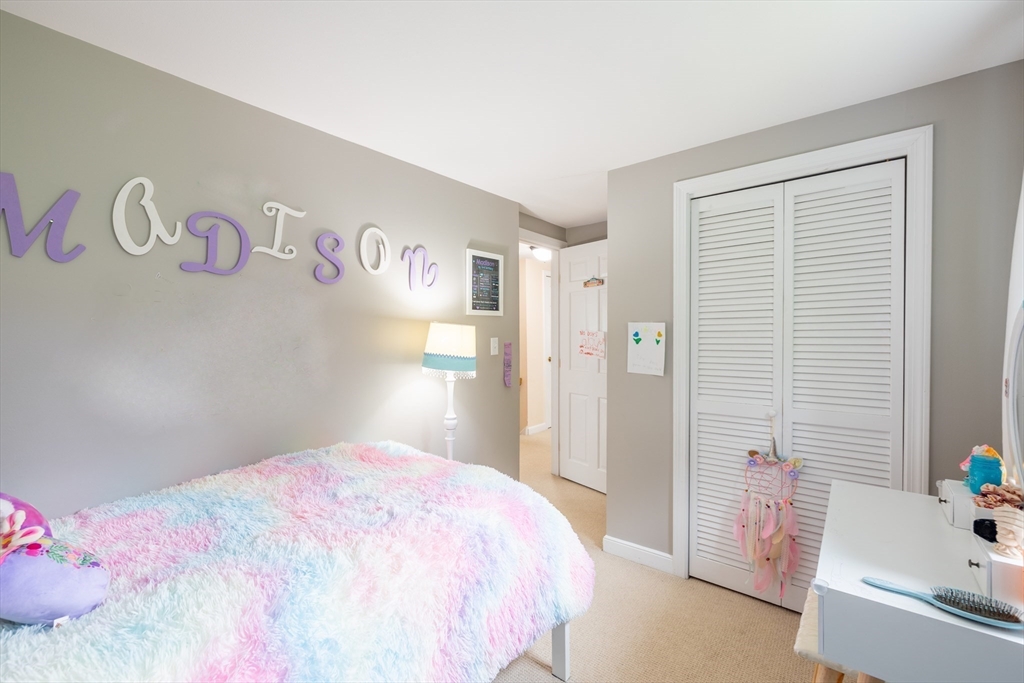 26 Roundtop Road Boxford, MA 01921 - Photo 31 of 42 a bedroom with a bed and a dresser
