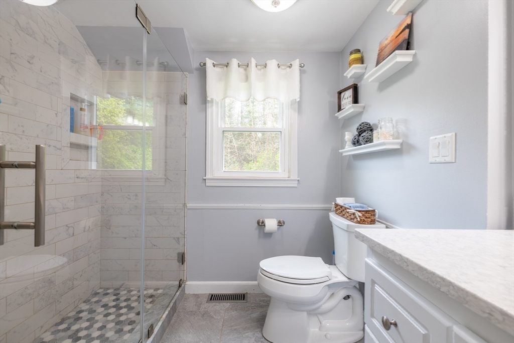26 Roundtop Road Boxford, MA 01921 - Photo 33 of 42 a bathroom with a toilet a sink and a shower