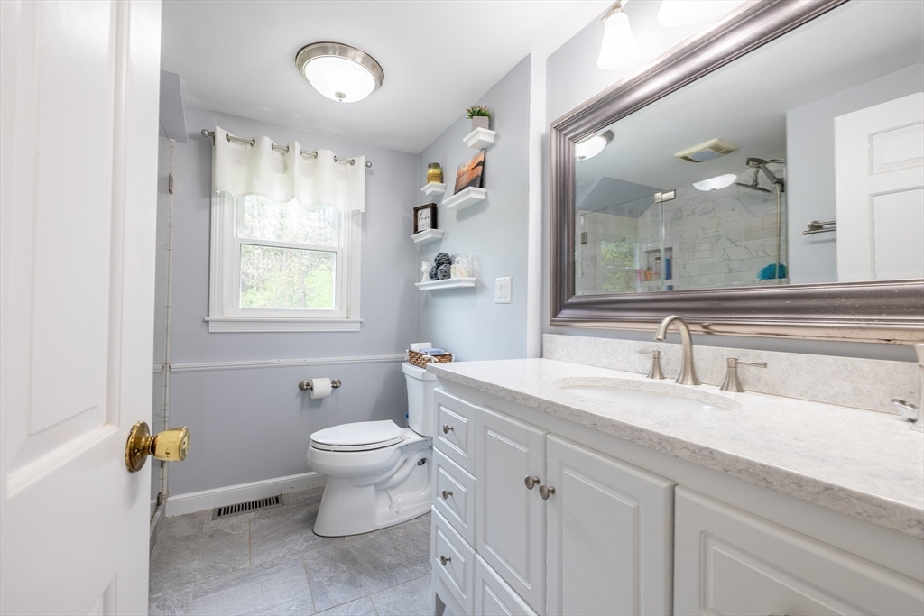 26 Roundtop Road Boxford, MA 01921 - Photo 34 of 42 a bathroom with a sink toilet and a mirror