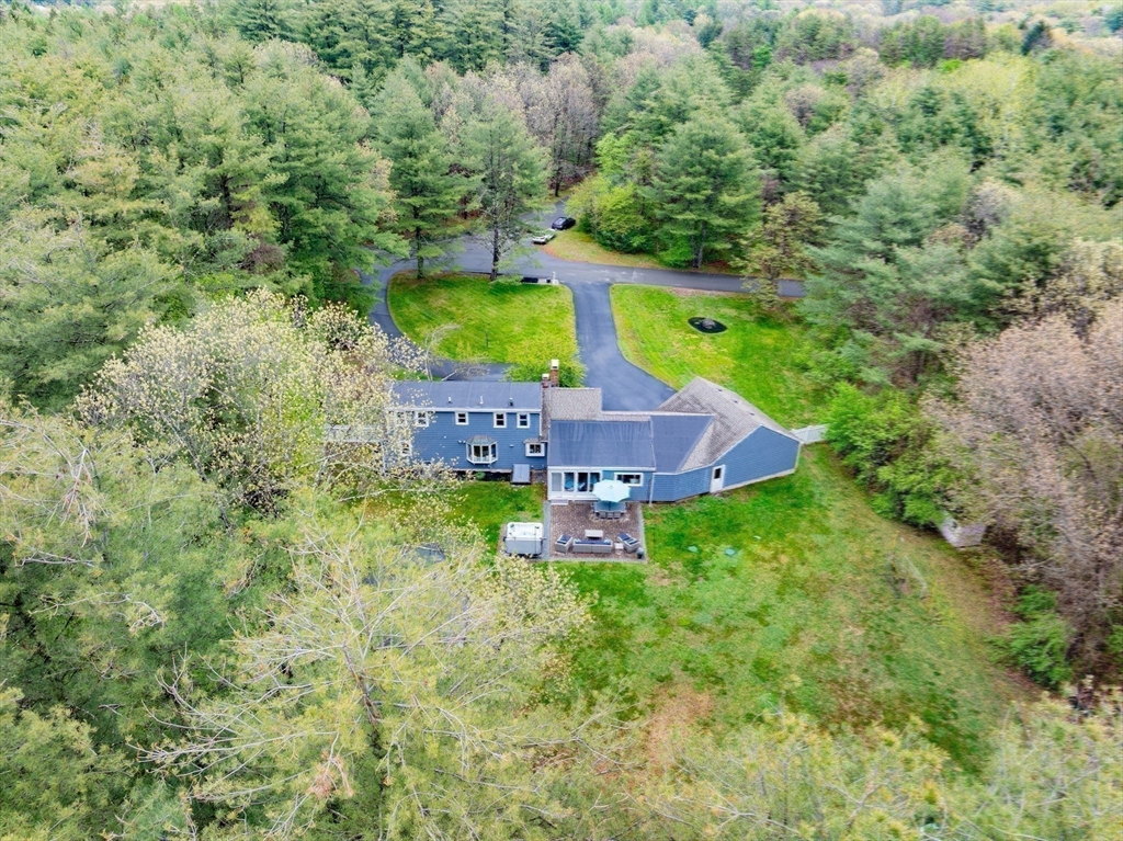 26 Roundtop Road Boxford, MA 01921 - Photo 38 of 42 a green field with lots of trees in it
