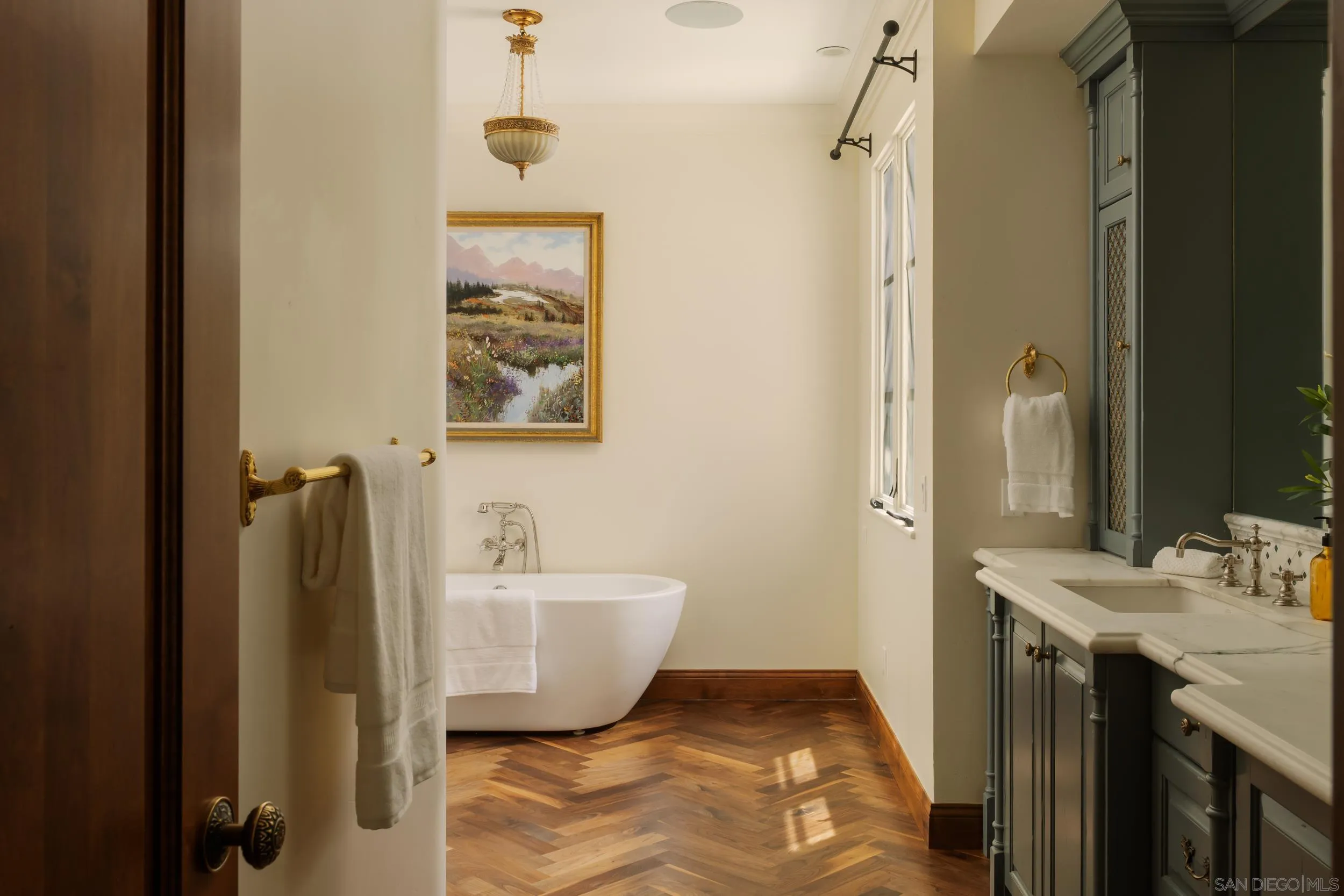 5406 Calzada Del Bosque Rancho Santa Fe, CA 92067 - Photo 13 of 30 a bathroom with a tub sink and mirror