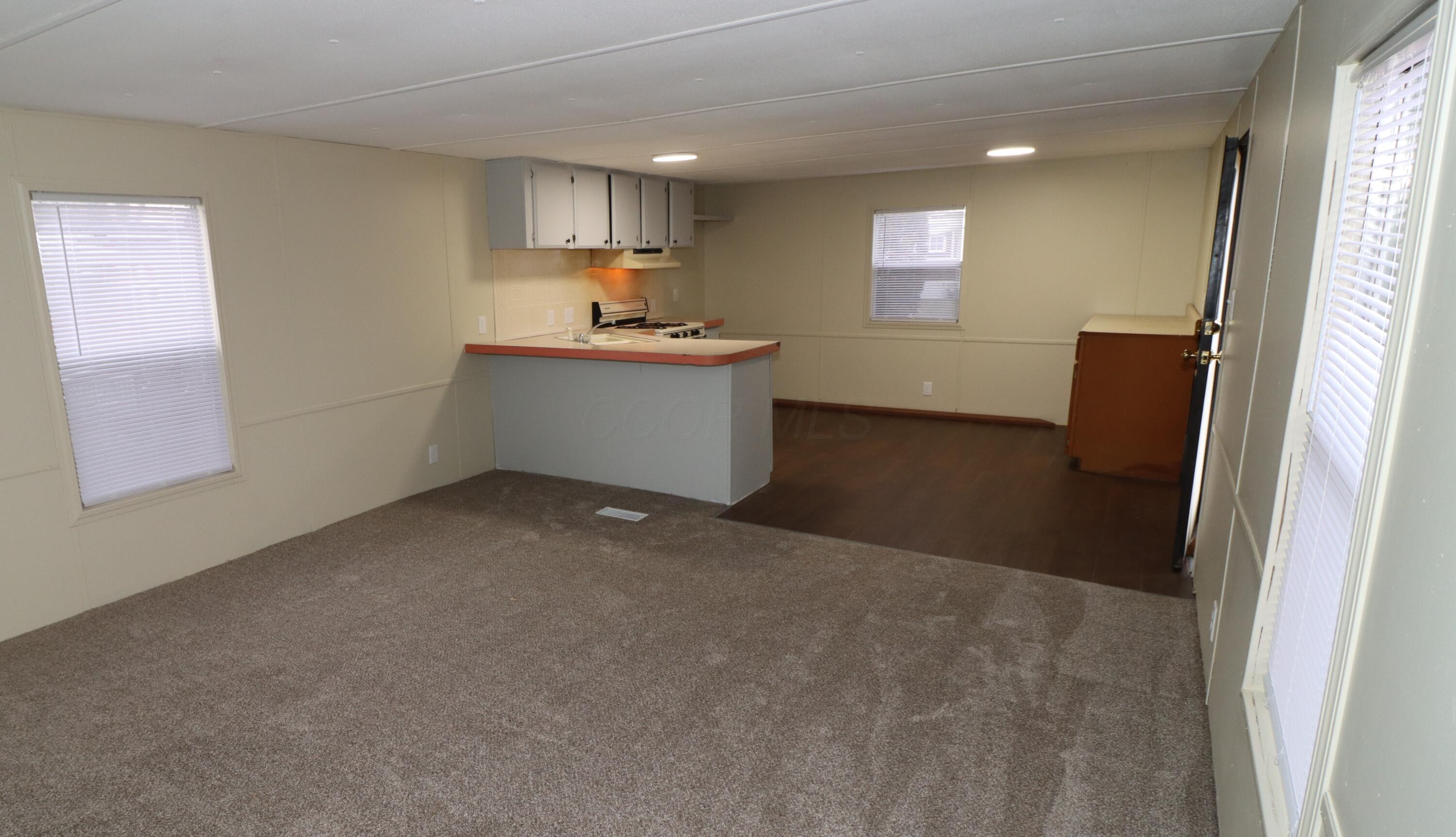 8565 Smith-Calhoun Road, Unit 192 Plain City, OH 43064 - Photo 8 of 18 Living Room looking into Kitchen