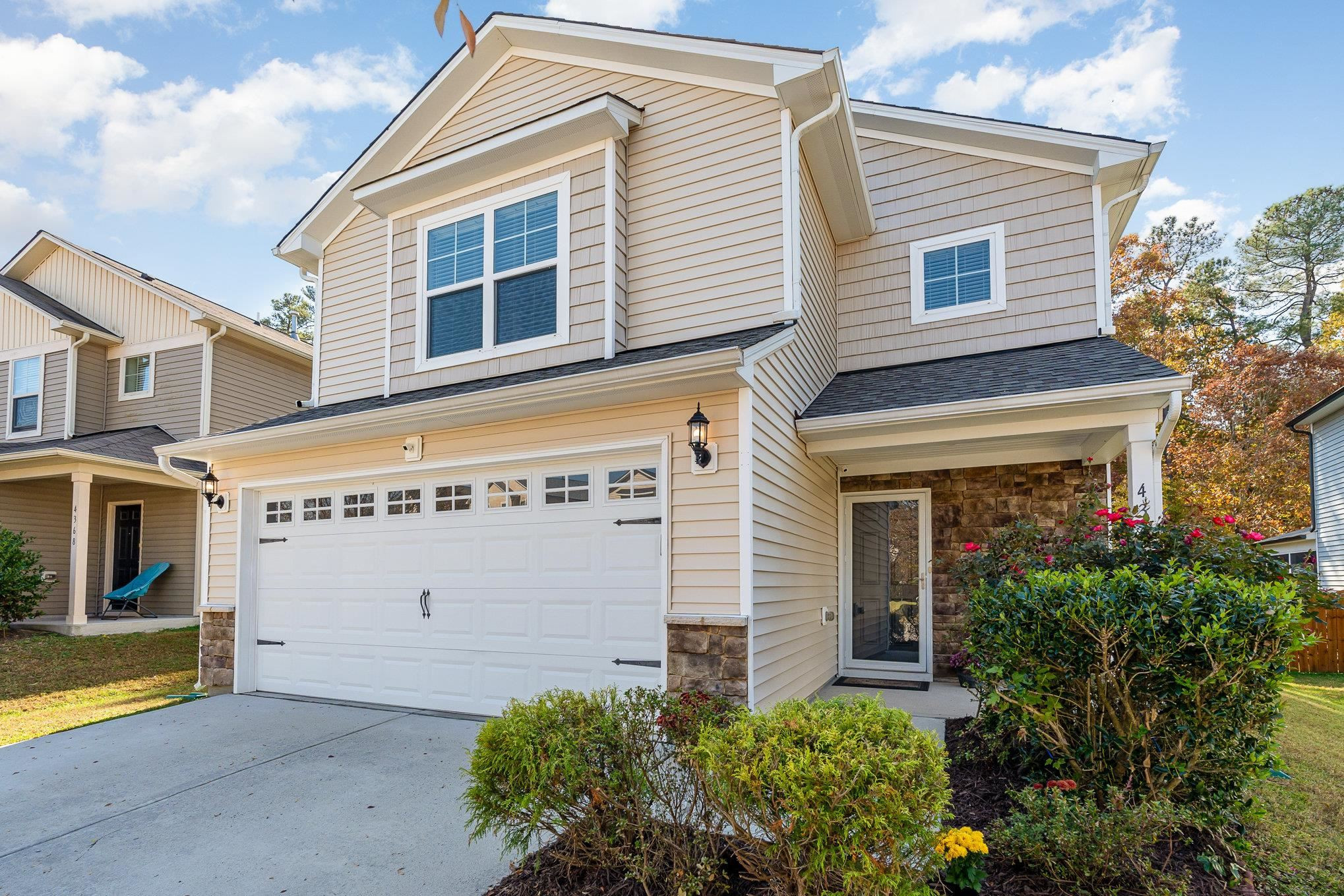 4364 Lyman Avenue Raleigh, NC 27616 - Photo 1 of 28 a front view of a house with a garden