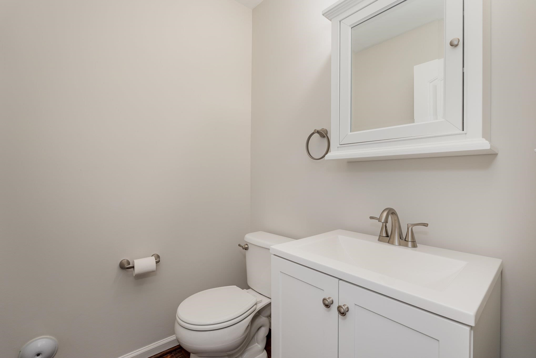 4364 Lyman Avenue Raleigh, NC 27616 - Photo 14 of 28 a bathroom with a sink a toilet and mirror