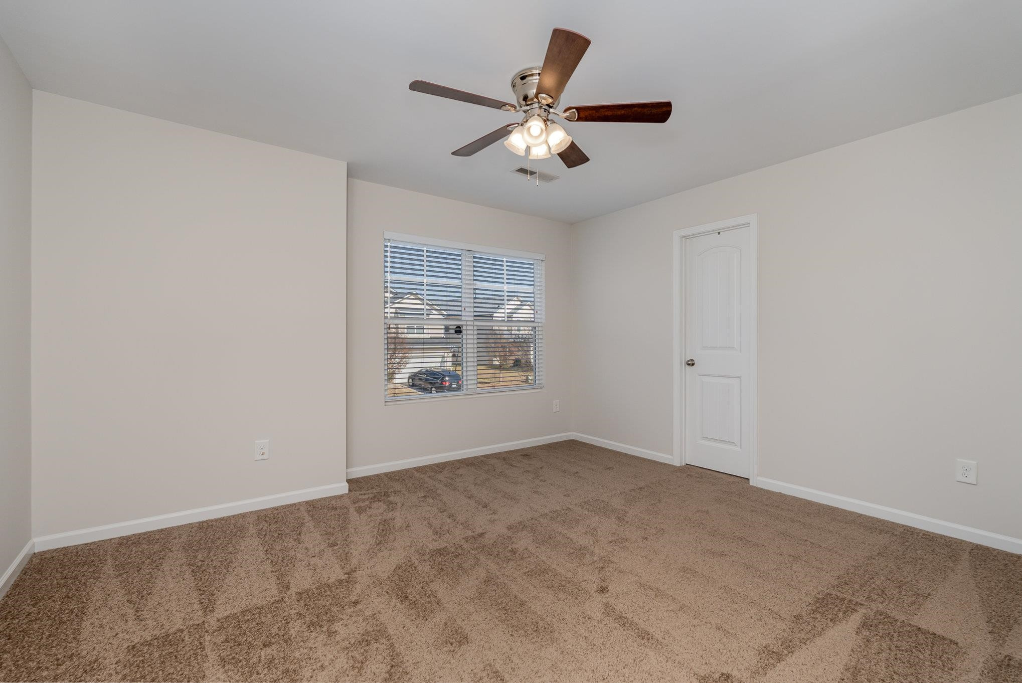 4364 Lyman Avenue Raleigh, NC 27616 - Photo 16 of 28 a view of an empty room with a window