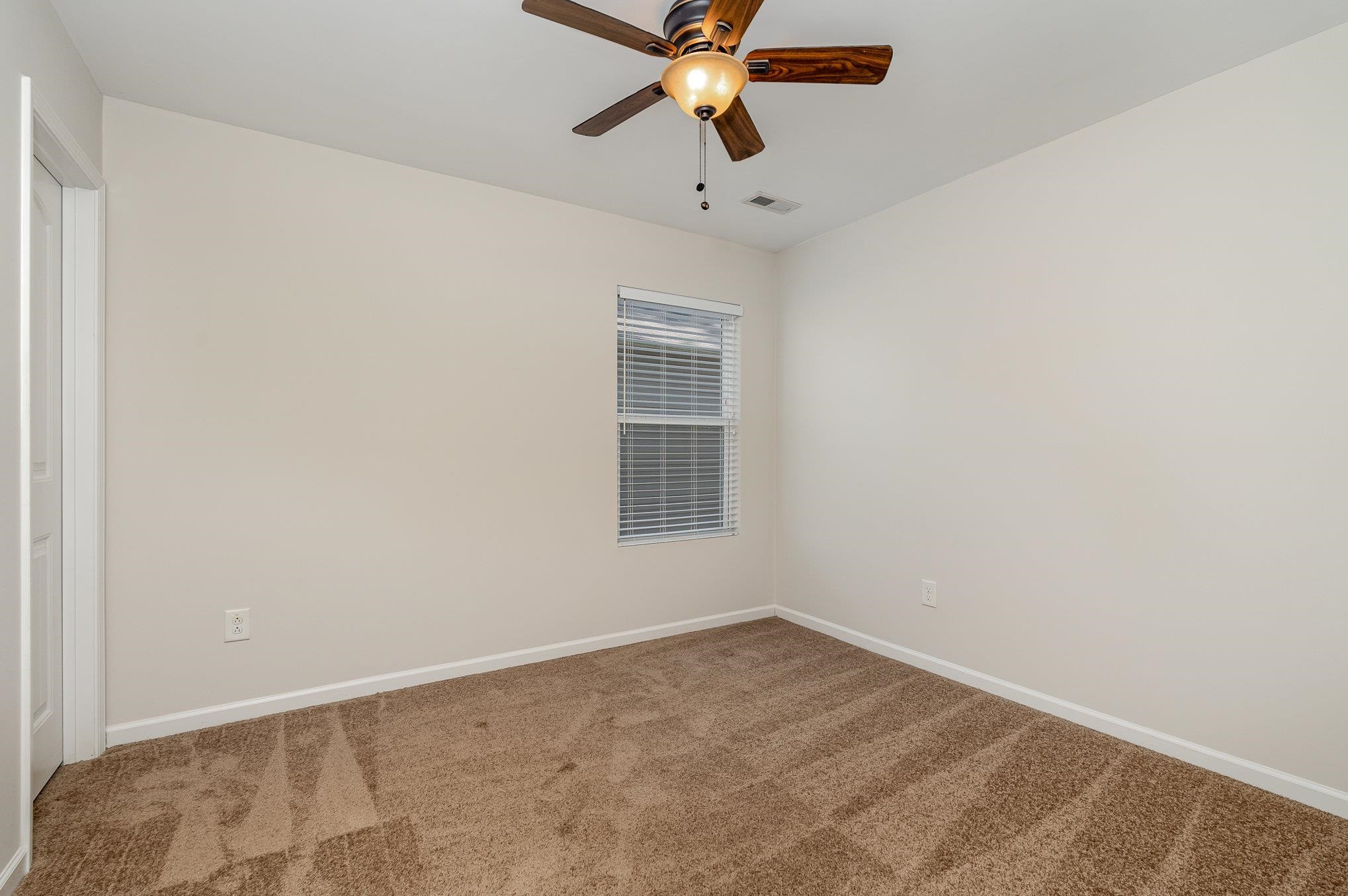 4364 Lyman Avenue Raleigh, NC 27616 - Photo 17 of 28 a view of empty room with a ceiling fan