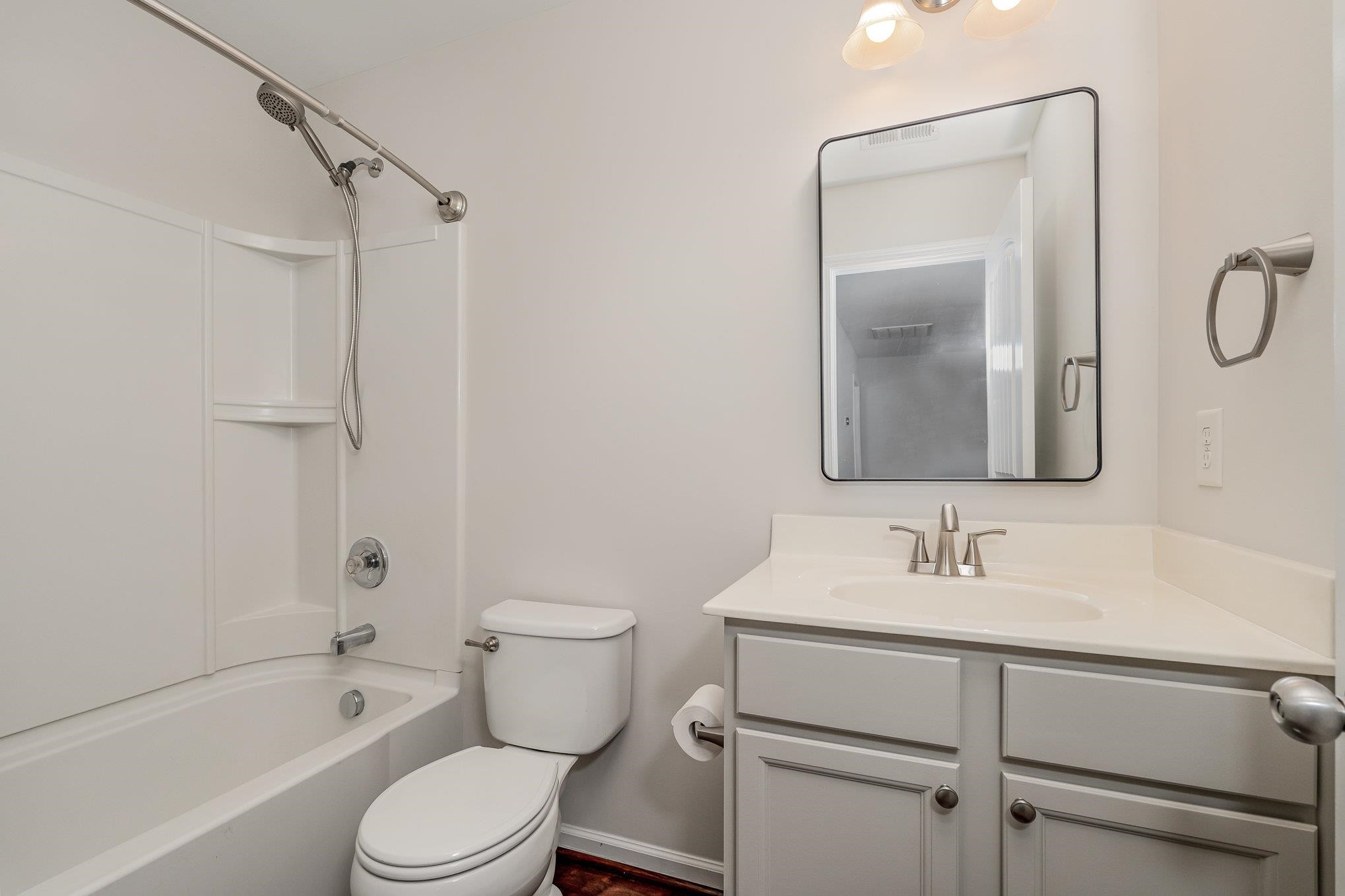 4364 Lyman Avenue Raleigh, NC 27616 - Photo 18 of 28 a bathroom with a sink toilet and shower