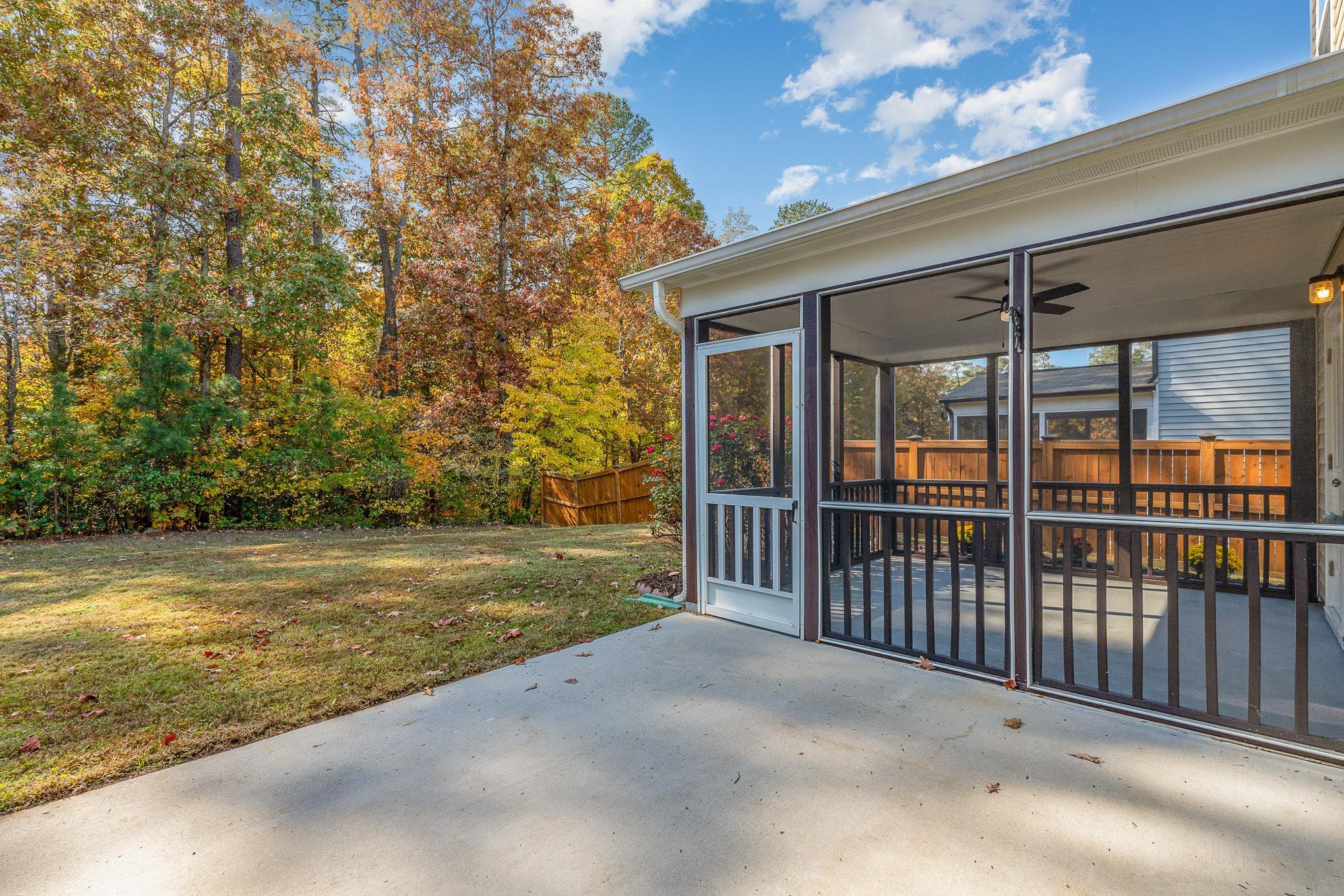 4364 Lyman Avenue Raleigh, NC 27616 - Photo 23 of 28 a view of a porch with wooden floor and fence