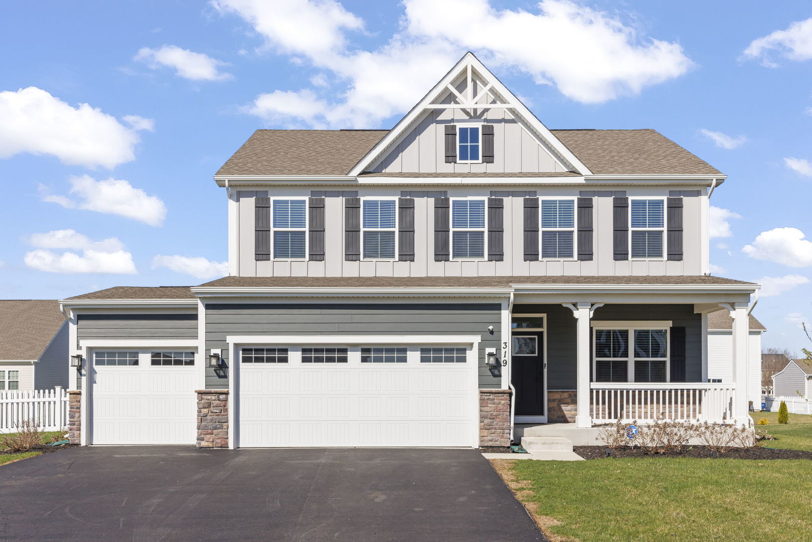 319 Atkinson Drive Sugar Grove, IL 60554 - Photo 1 of 35 a front view of a house with a yard