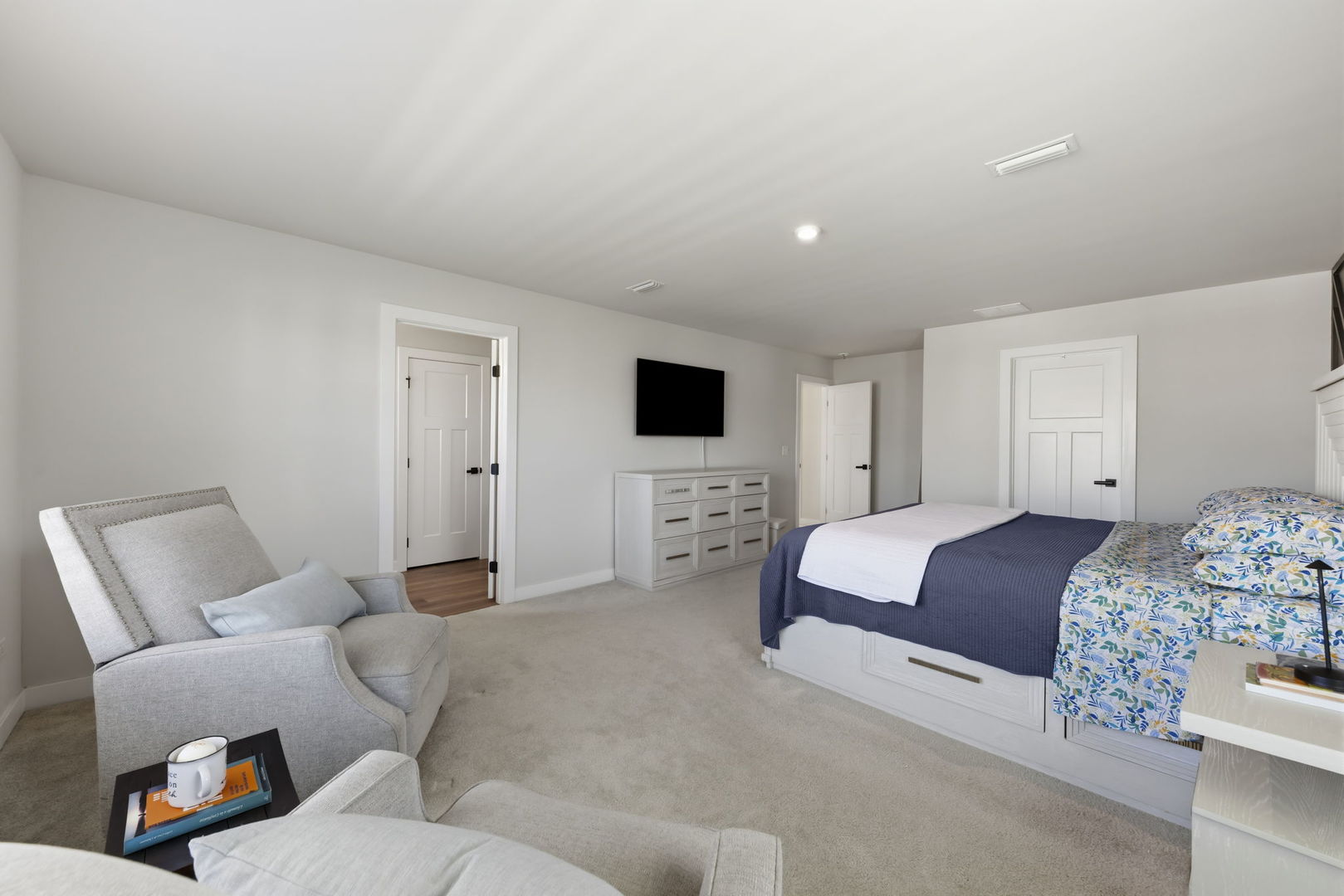 319 Atkinson Drive Sugar Grove, IL 60554 - Photo 13 of 35 a bedroom with a bed a couch and a flat screen tv