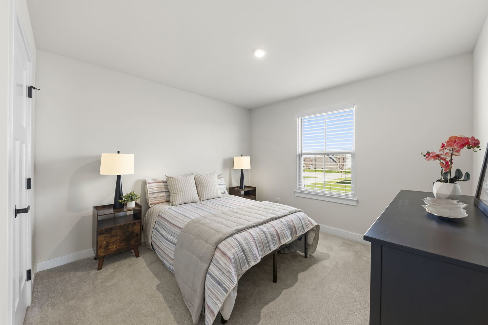 319 Atkinson Drive Sugar Grove, IL 60554 - Photo 17 of 35 a bedroom with a bed and a table