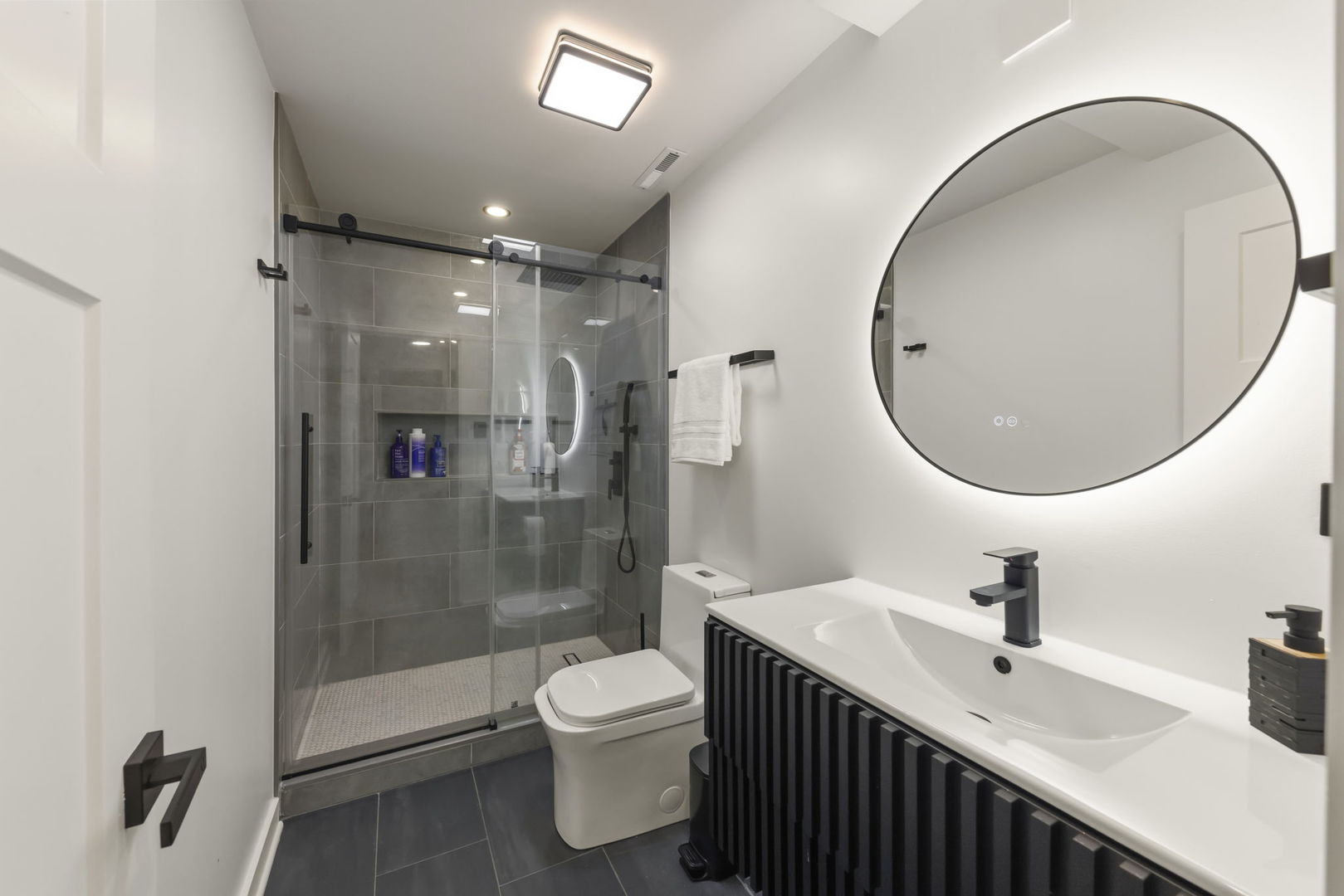 319 Atkinson Drive Sugar Grove, IL 60554 - Photo 26 of 35 a bathroom with a sink a toilet and a mirror