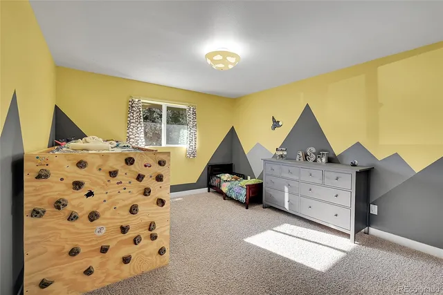 a bed room with a bed and a window