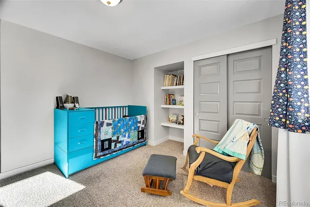 a living room with furniture and a gate