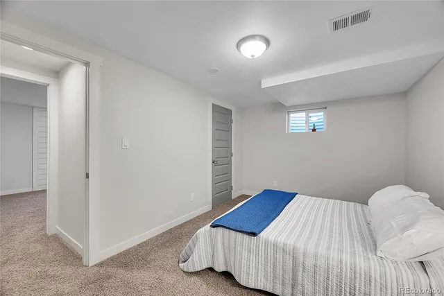 a bedroom with a bed and a cabinets