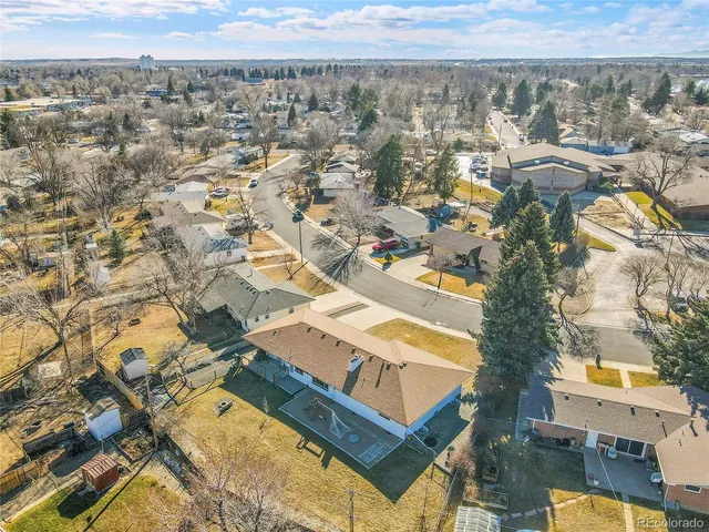 an aerial view of residential houses with outdoor space