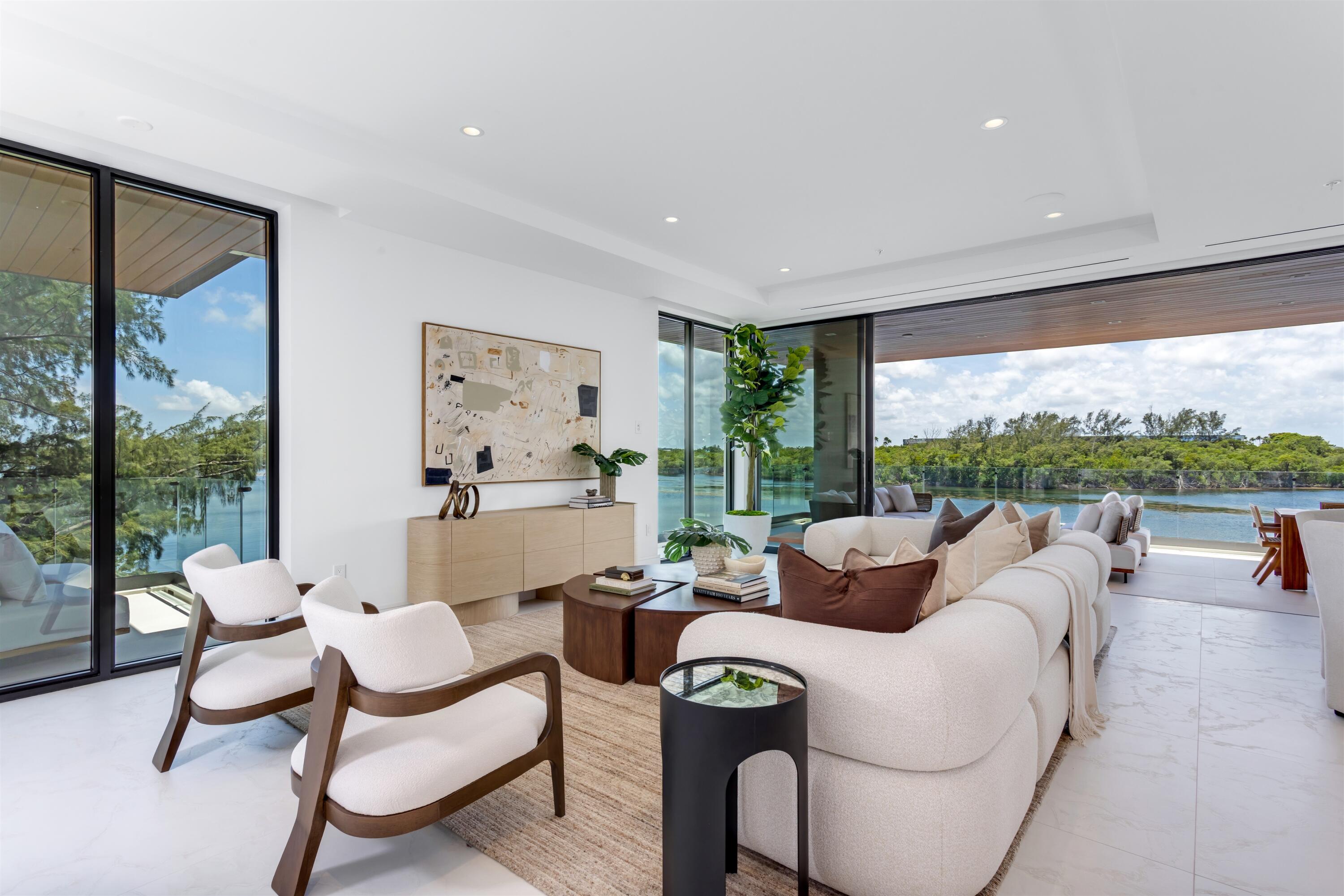 900 Lago Mar Lane, Unit PH Boca Raton, FL 33431 - Photo 4 of 58 a living room with furniture and a large window