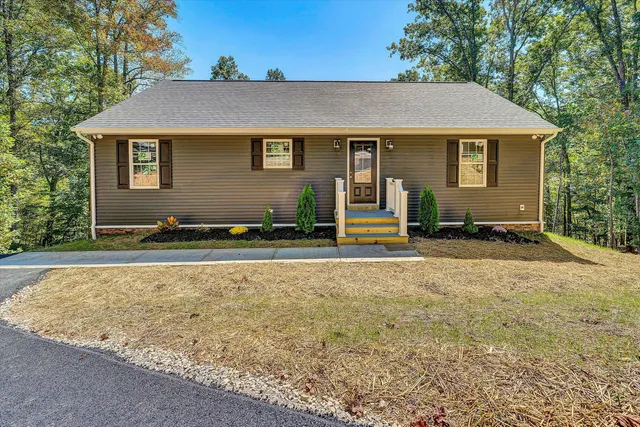 front view of a house with a yard