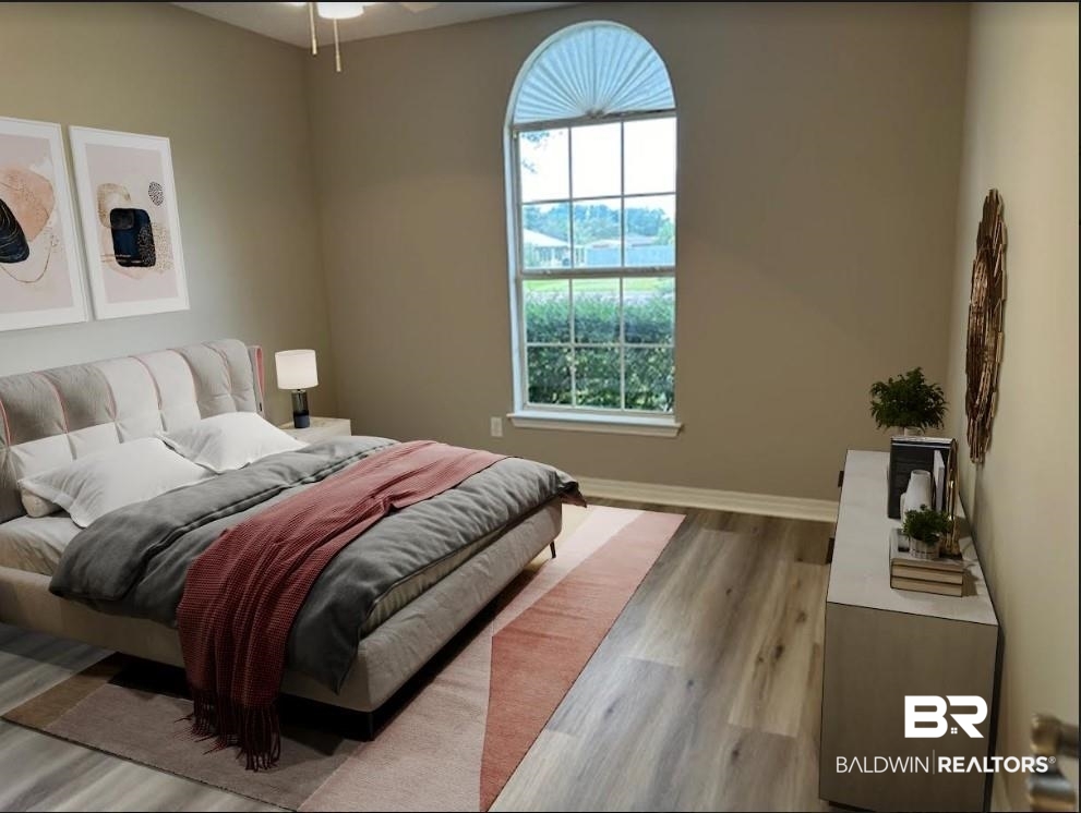 1512 North Cedar Street Foley, AL 36535 - Photo 8 of 13 Bedroom with light wood-type flooring and multiple windows