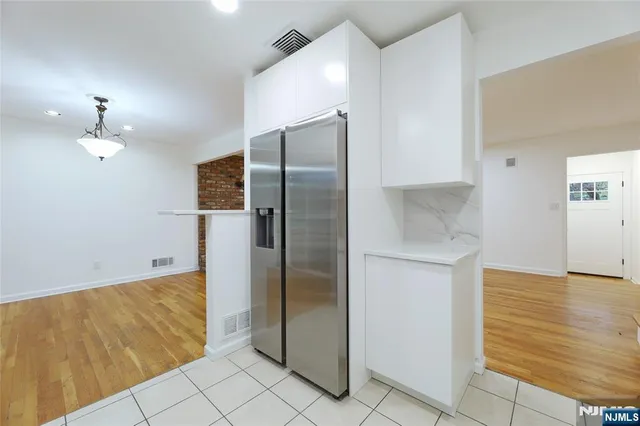a bathroom with a shower and a mirror