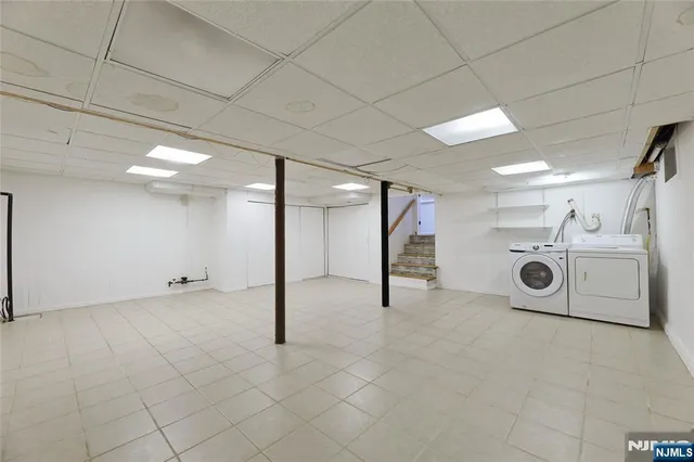 a view of a refrigerator and washer in a room