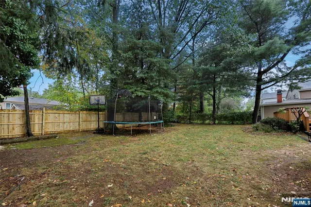 a view of a backyard with a trees